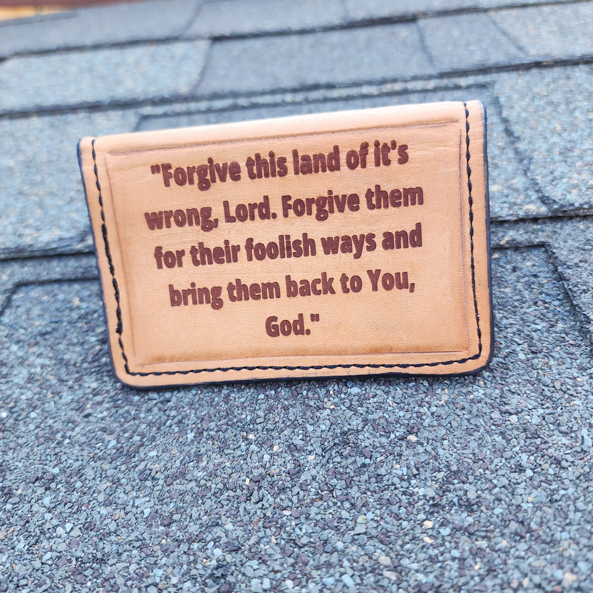 Leather minimalist wallet with engraved cowboy and cross