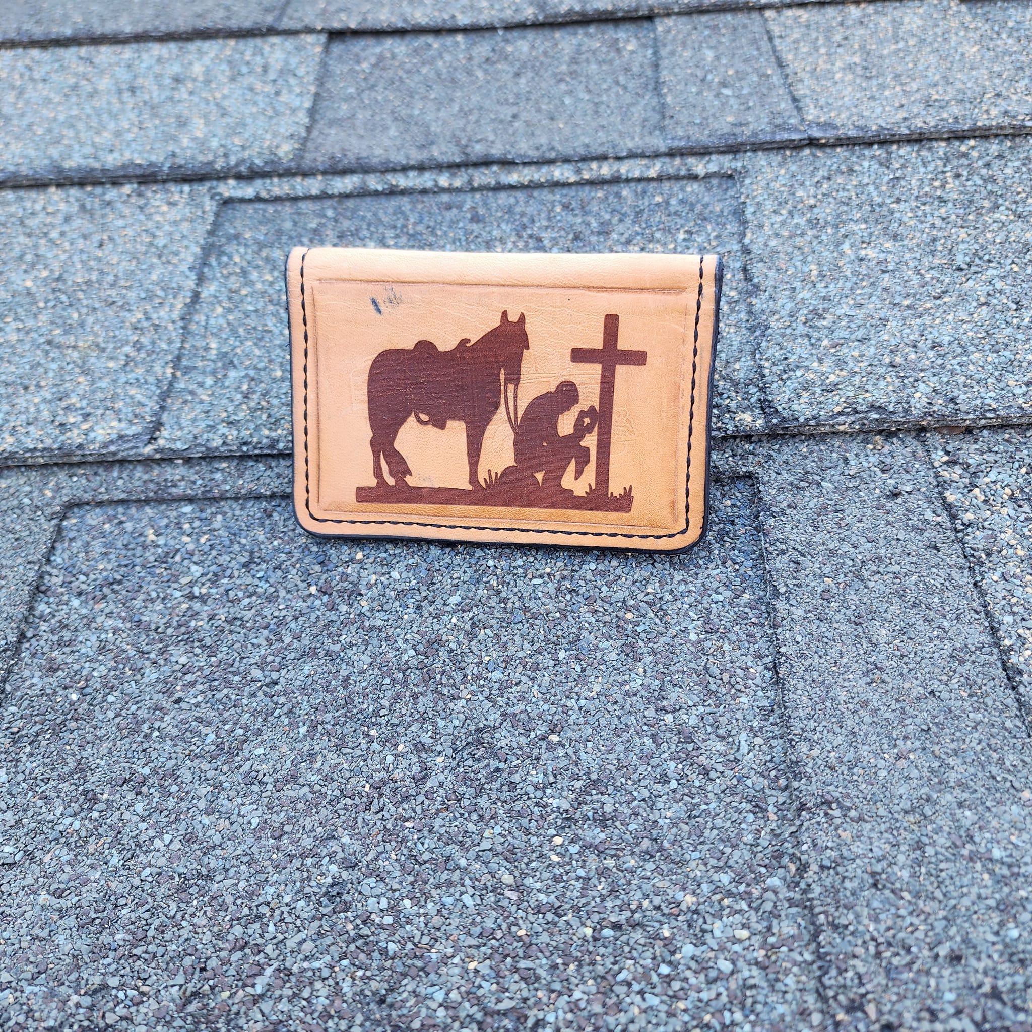 Leather minimalist wallet with engraved cowboy and cross