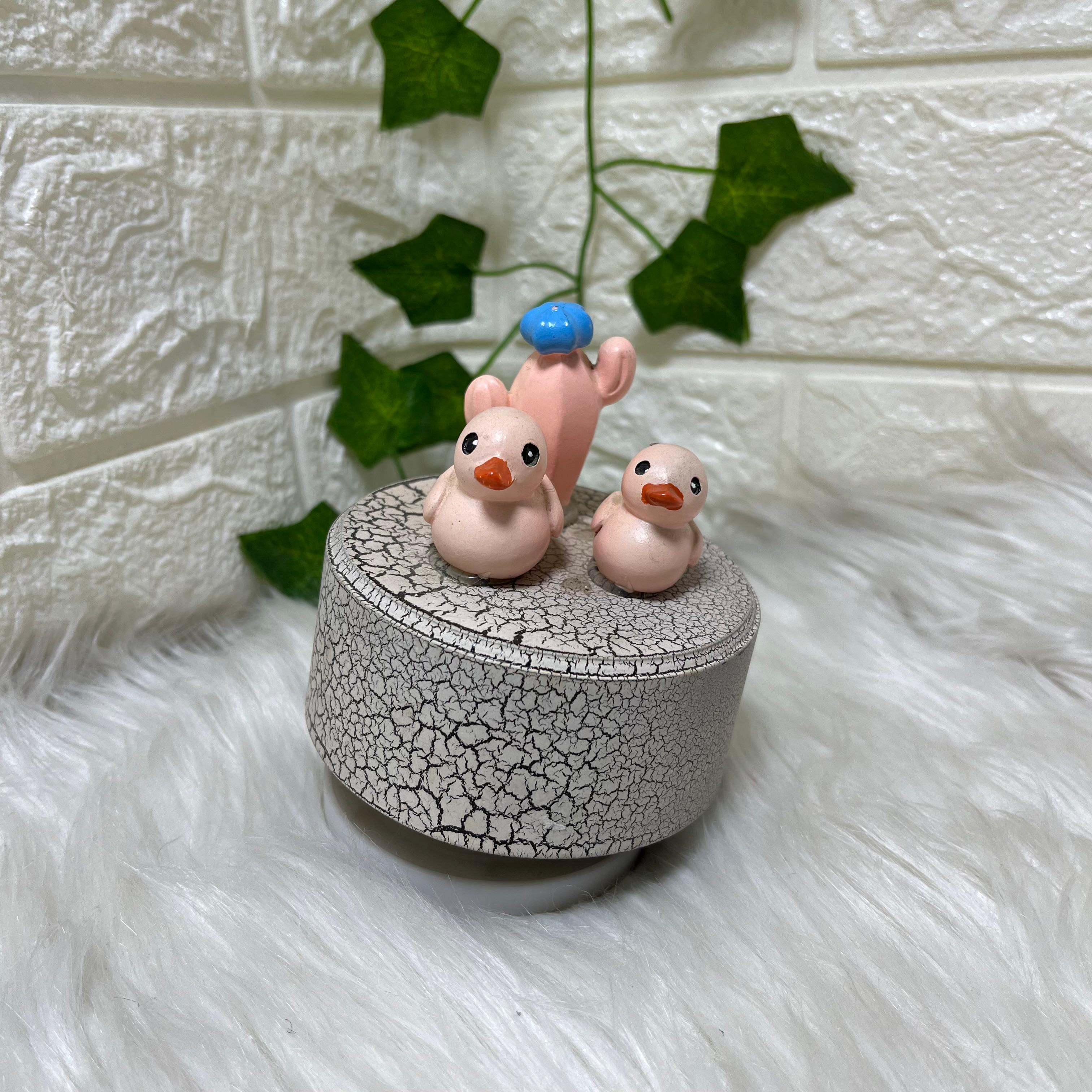Ceramic Duck Figurines on Pedestal (music box)