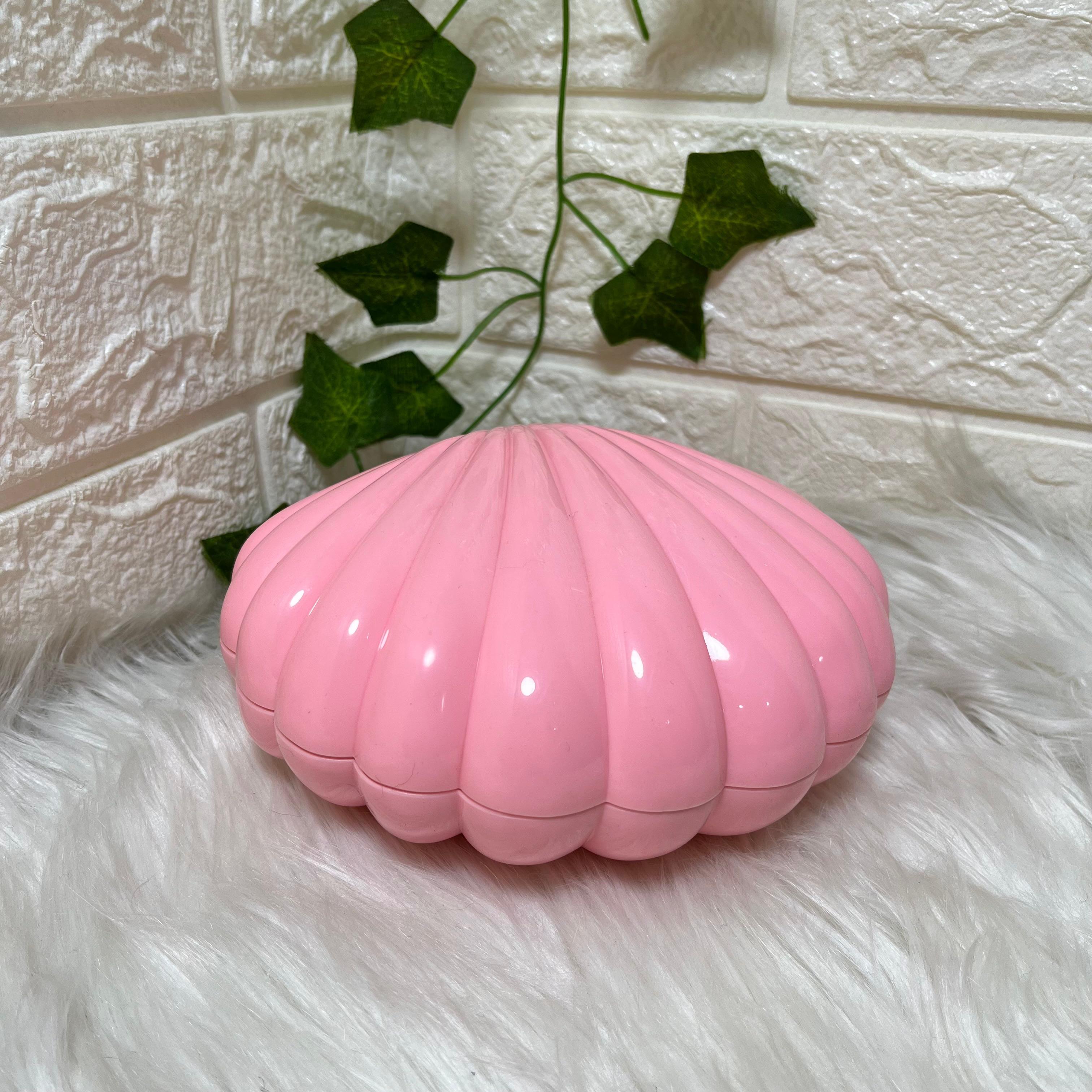Pink shell-shaped music box