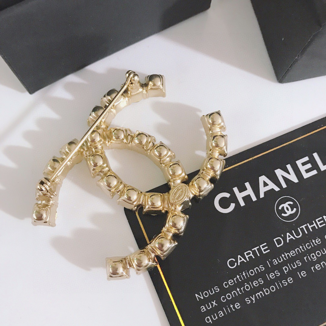 Gold-Tone Double-Loop Brooch Adorned with Clear Crystals