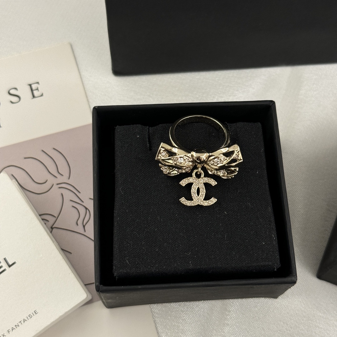 Gold-Toned Jewelry Set with Crystal Bow Motifs (Necklace, Earrings, Brooch, Ring)