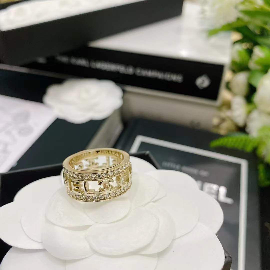 Gold-Tone Wide Band Ring with Openwork Motifs & Crystal Accents