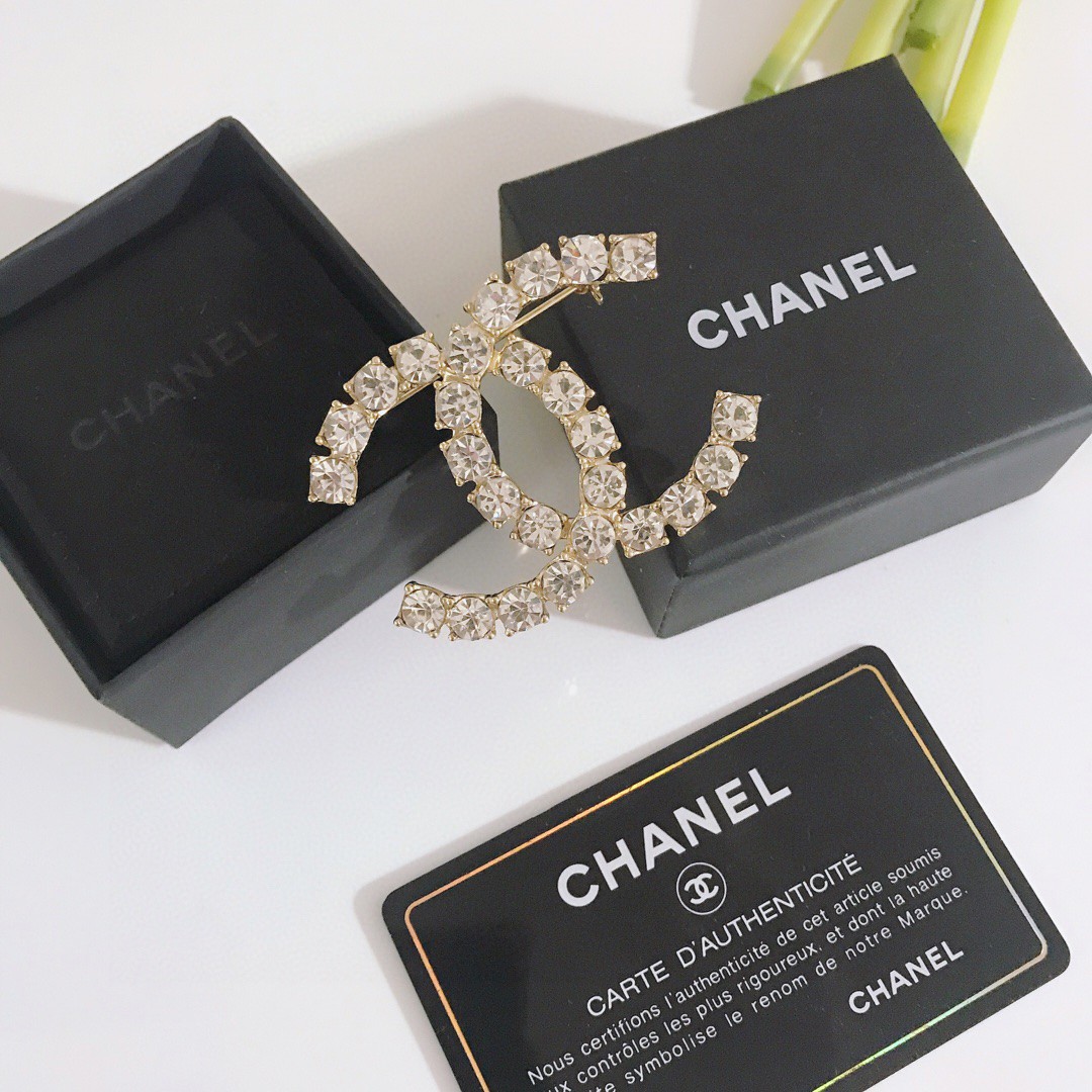 Gold-Tone Double-Loop Brooch Adorned with Clear Crystals