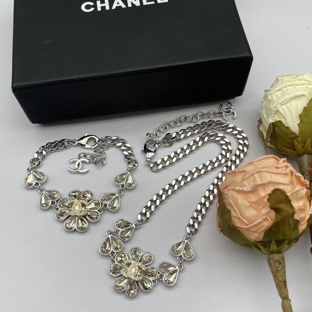  Silver-Toned Jewelry Set with Crystal Flower Motifs (Necklace, Bracelet, 2 Earring Styles, Ring)