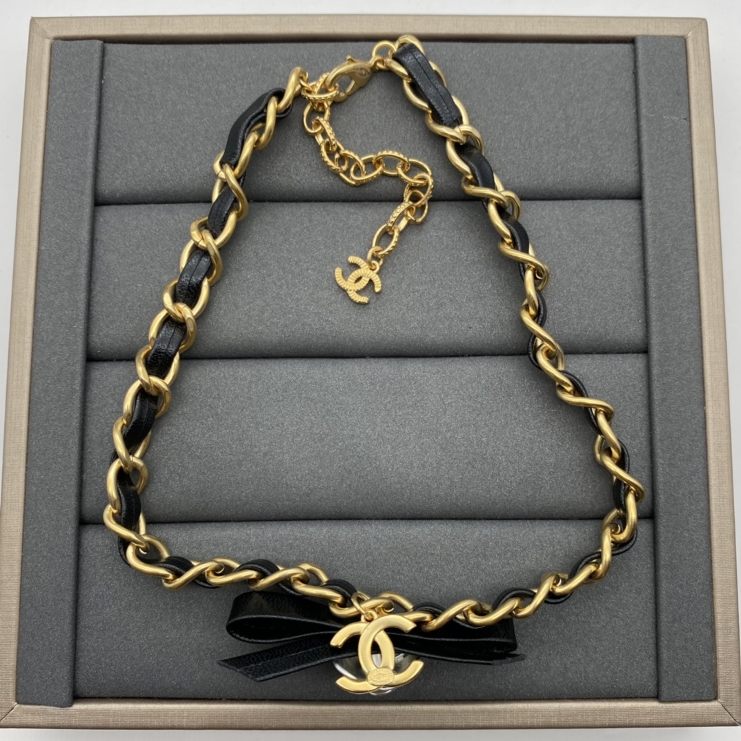 Jewelry Set with Black PU Leather, Camellia, and Interlocking Detail Accents in Gold Tones