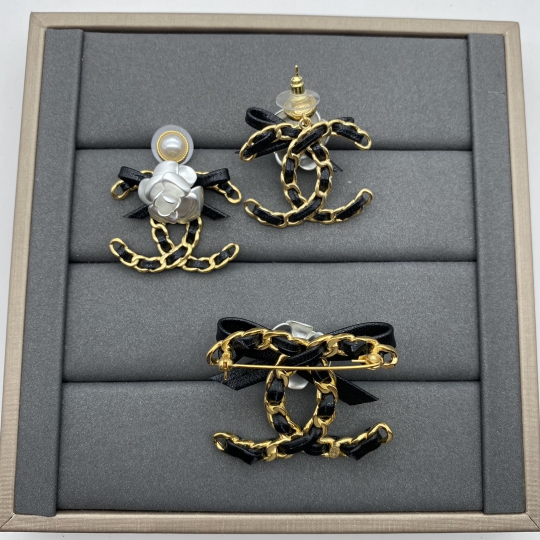 Jewelry Set with Black PU Leather, Camellia, and Interlocking Detail Accents in Gold Tones