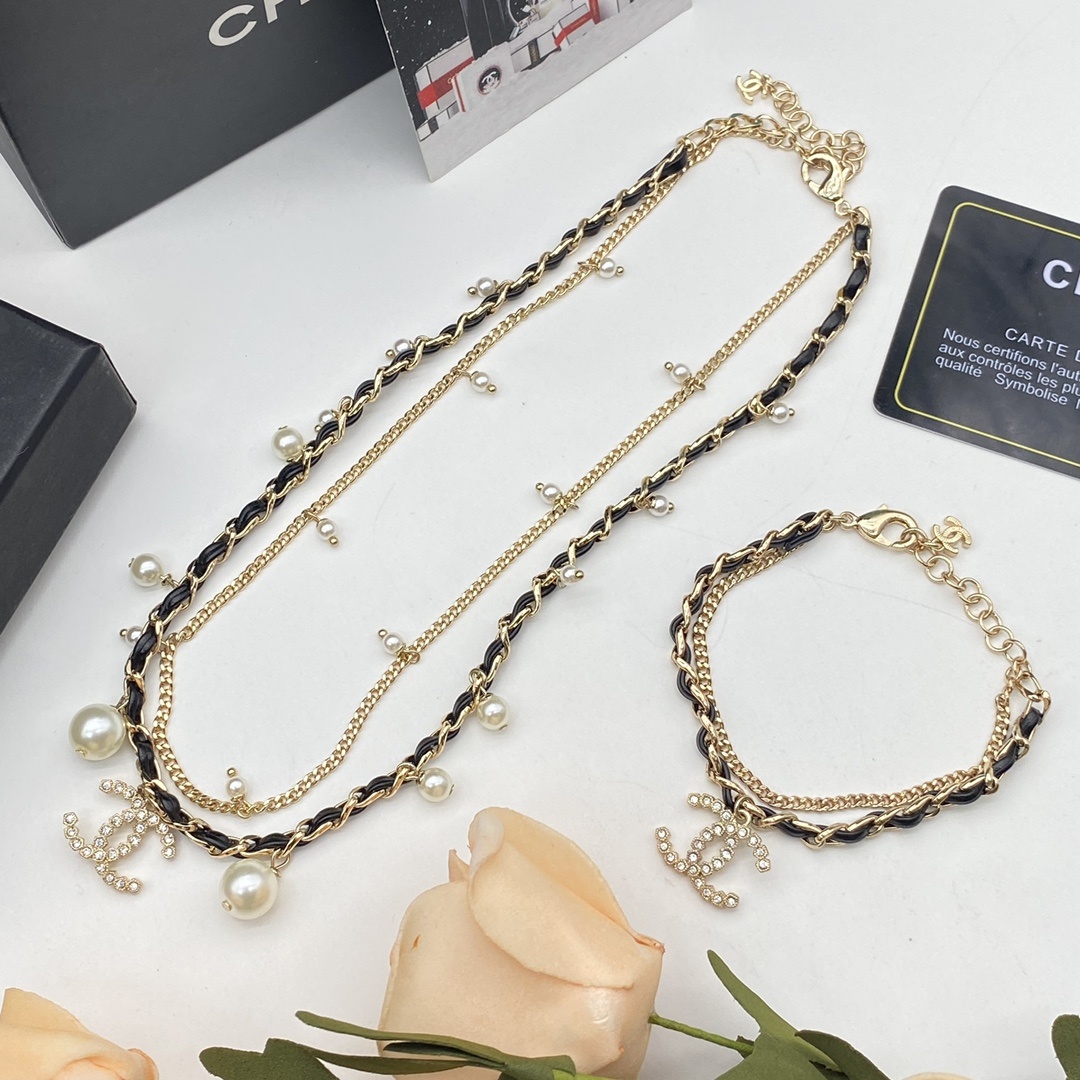 Jewelry Set with Double-Layered Black PU Leather, Pearl, Crystal, and Interlocking Detail Accents in Gold Tones