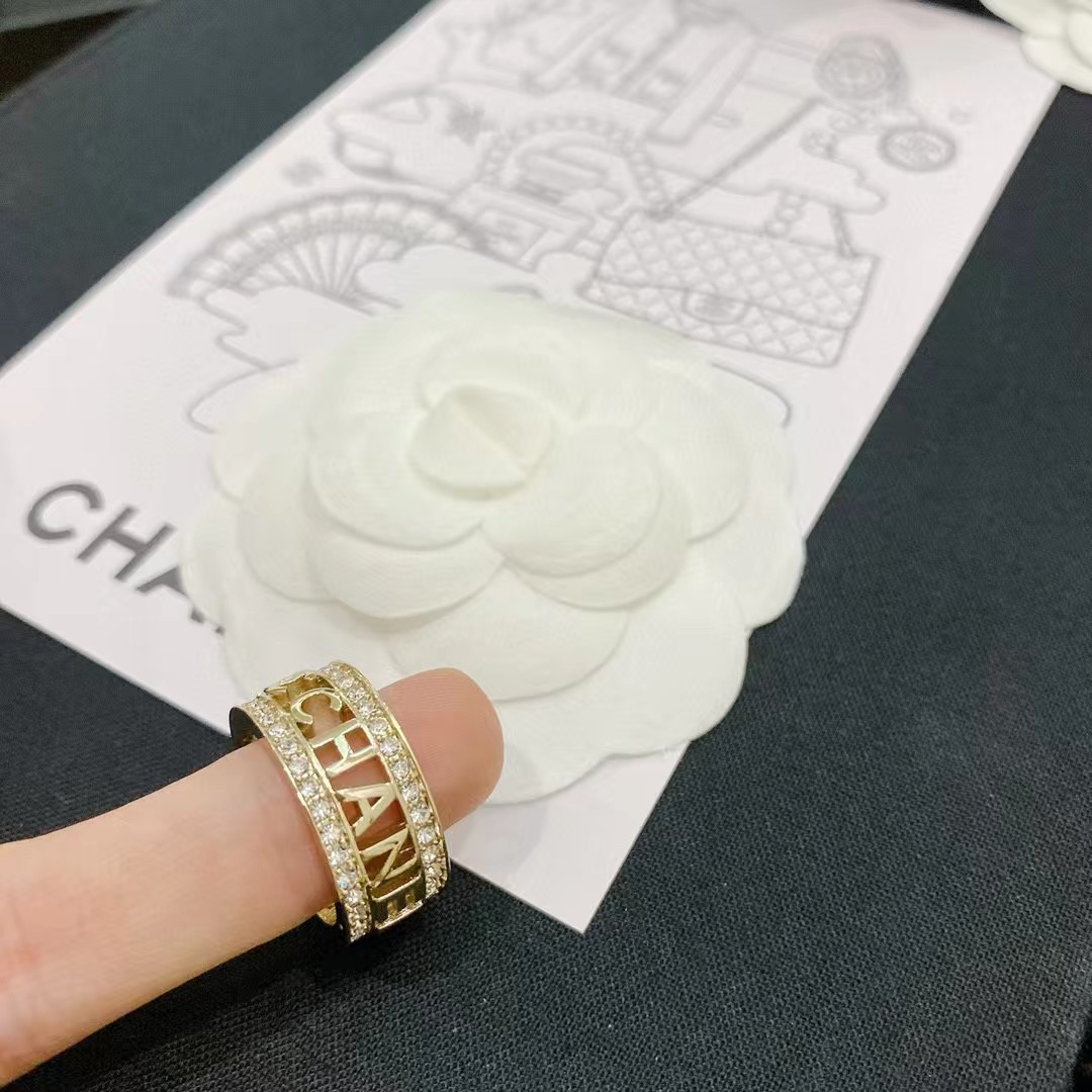 Gold-Tone Wide Band Ring with Openwork Motifs & Crystal Accents