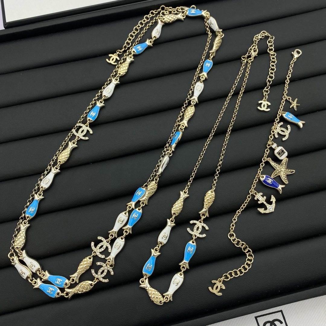 Gold-Toned Jewelry Set with Nautical & Fish Enamel Motifs (2 Necklaces, Bracelet)