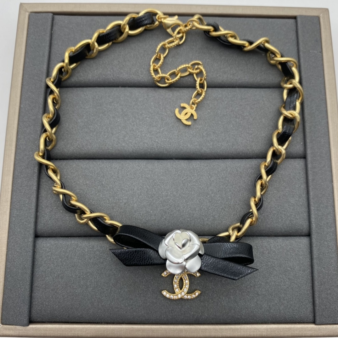 Jewelry Set with Black PU Leather, Camellia, and Interlocking Detail Accents in Gold Tones