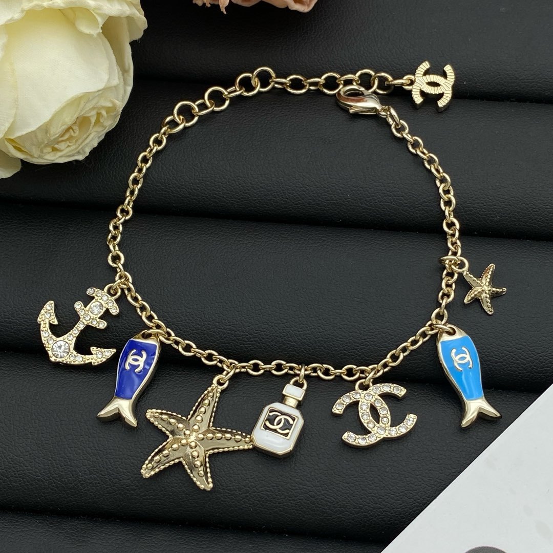 Gold-Toned Jewelry Set with Nautical & Fish Enamel Motifs (2 Necklaces, Bracelet)