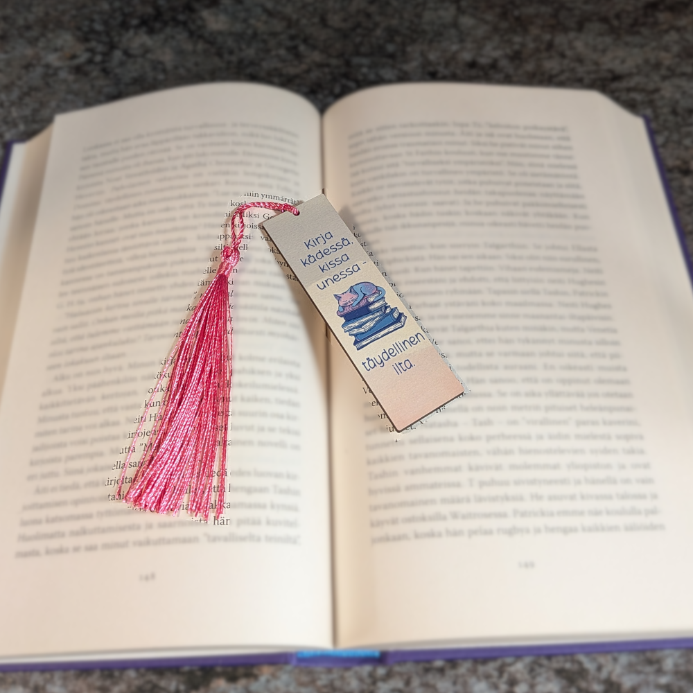 Kirja kädessä kissa unessa - kirjanmerkki