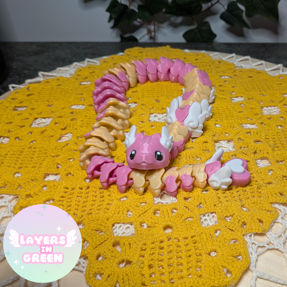 Cubid Dragon – Vaaleanpunainen pastelliloitsu