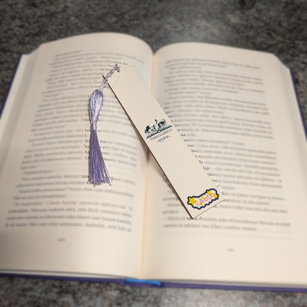 Kirja kädessä kissa unessa - kirjanmerkki