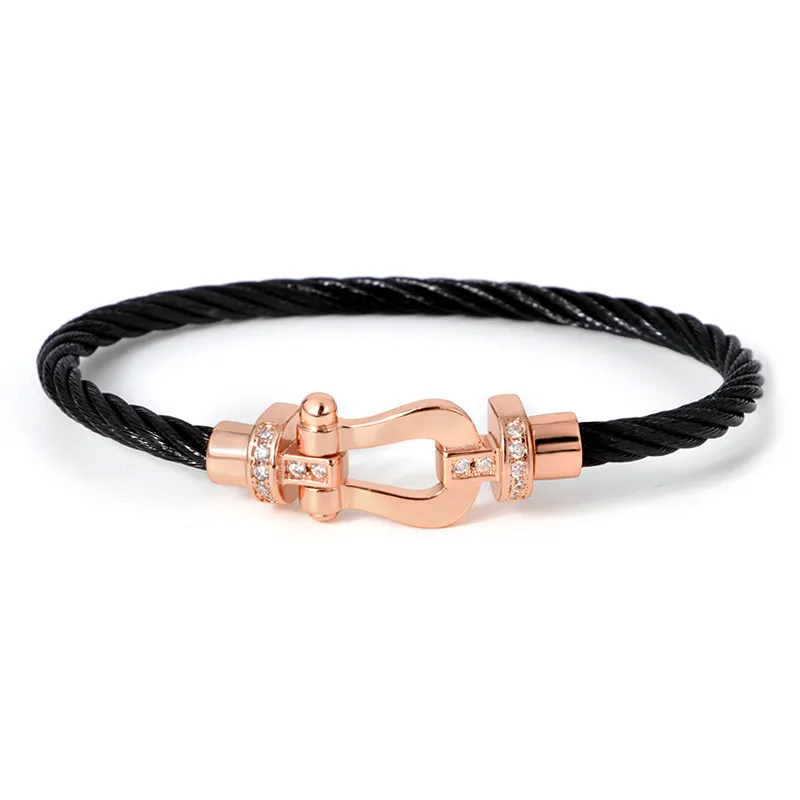 Bracelet câble en acier et fermoir doré rose