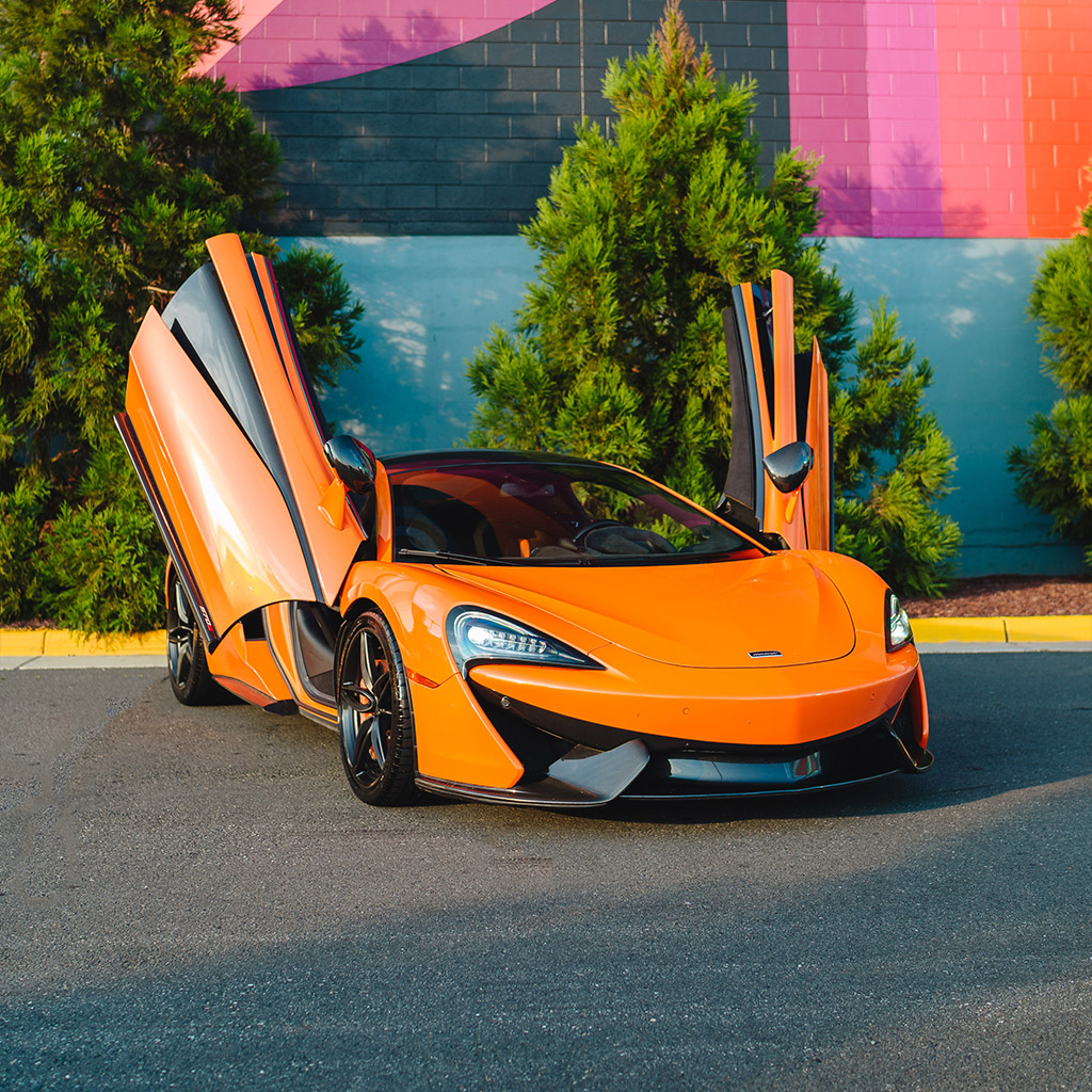 McLaren 570S — Ventura Orange on Carbon Black