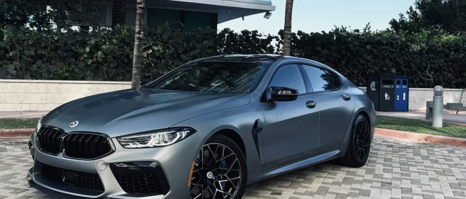 BMW M8 Competition Gran Coupe – Frozen Grey II Metallic on Black & Sakhir Orange