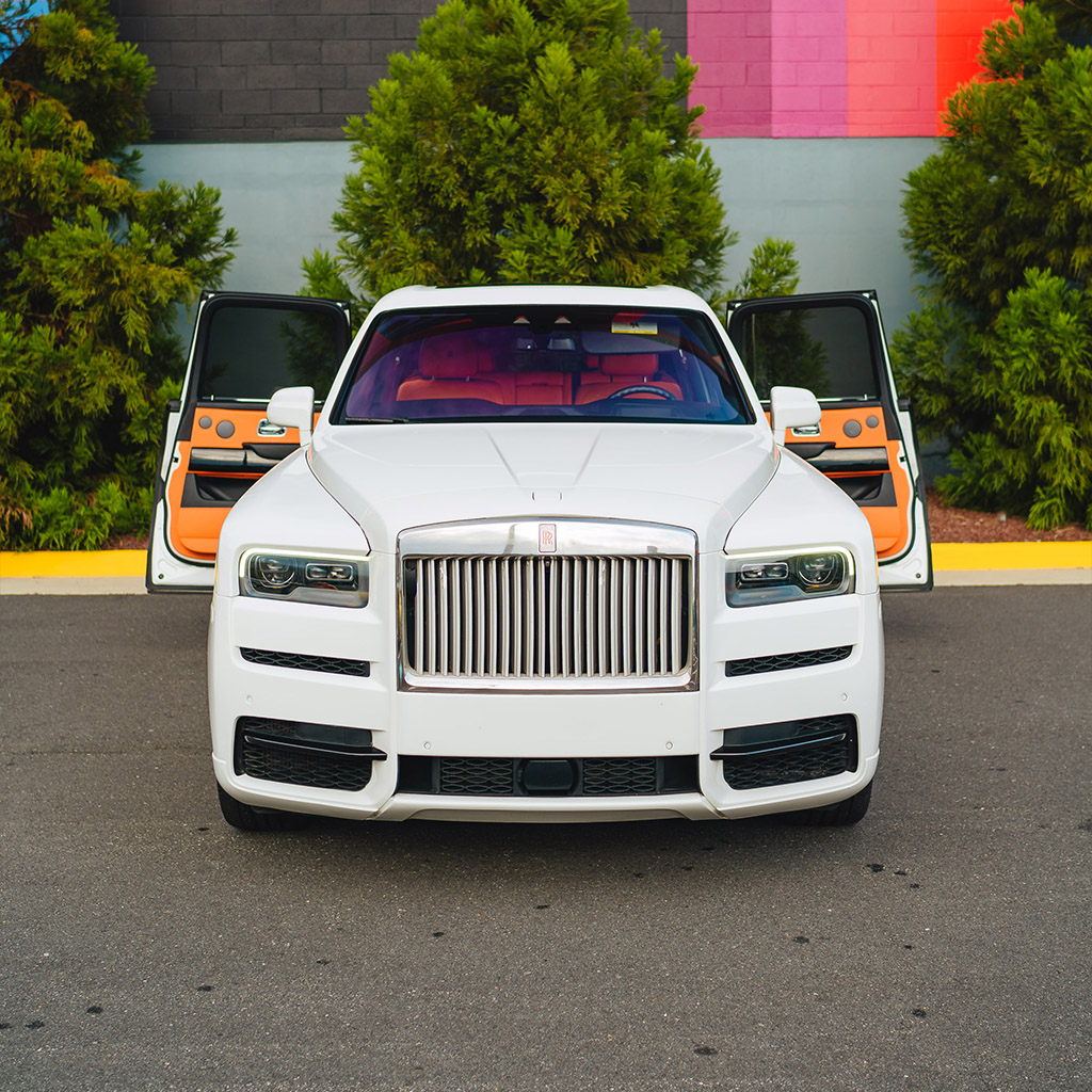 Rolls-Royce Cullinan — Arctic White on Mandarin & Black