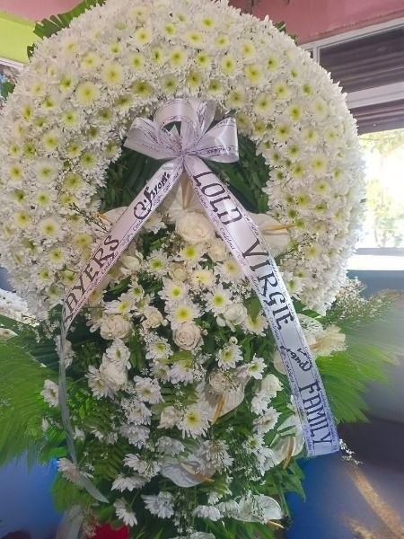 condolence arrangement with white blooms