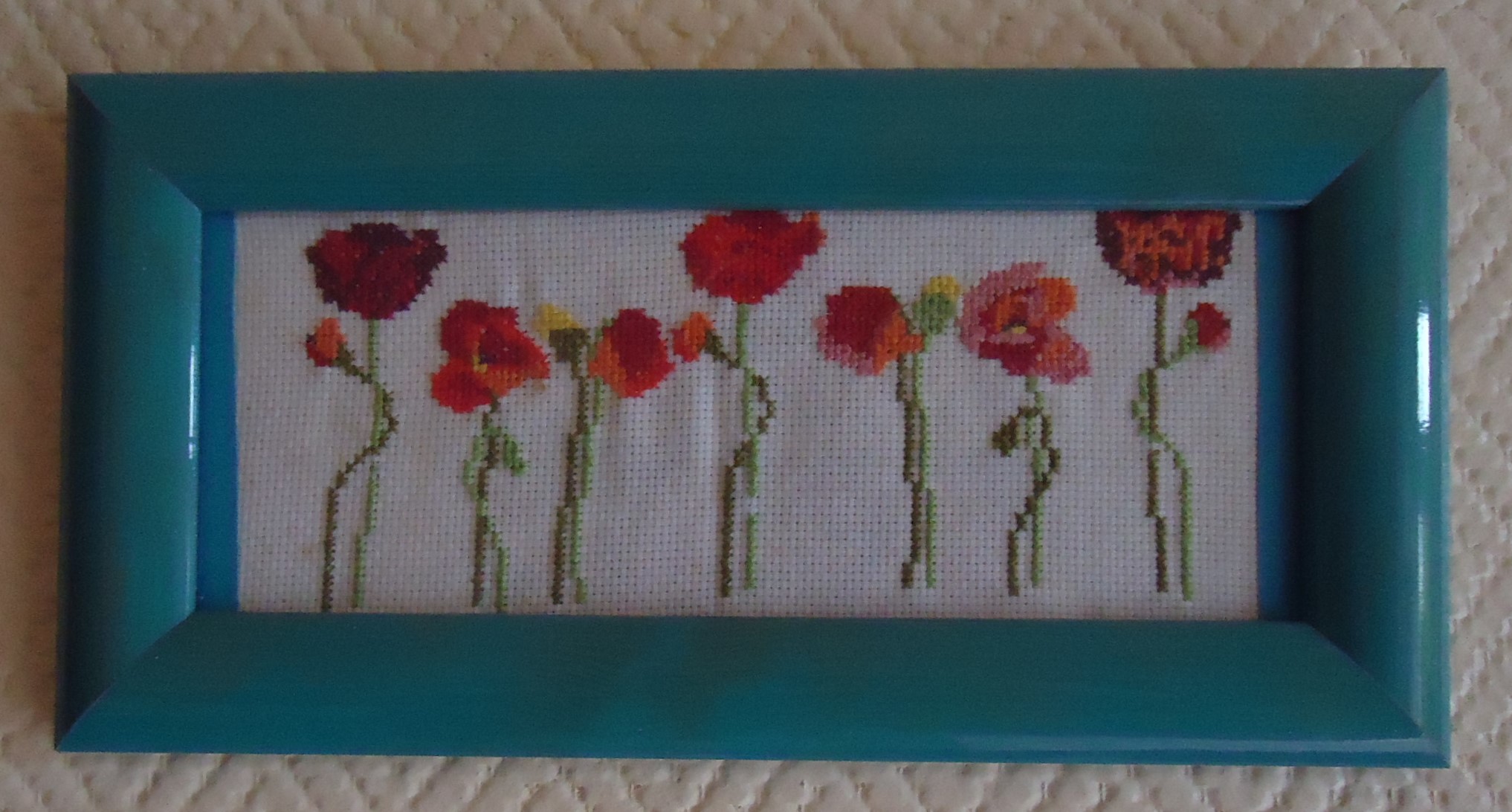 Broderie de fleurs encadrée