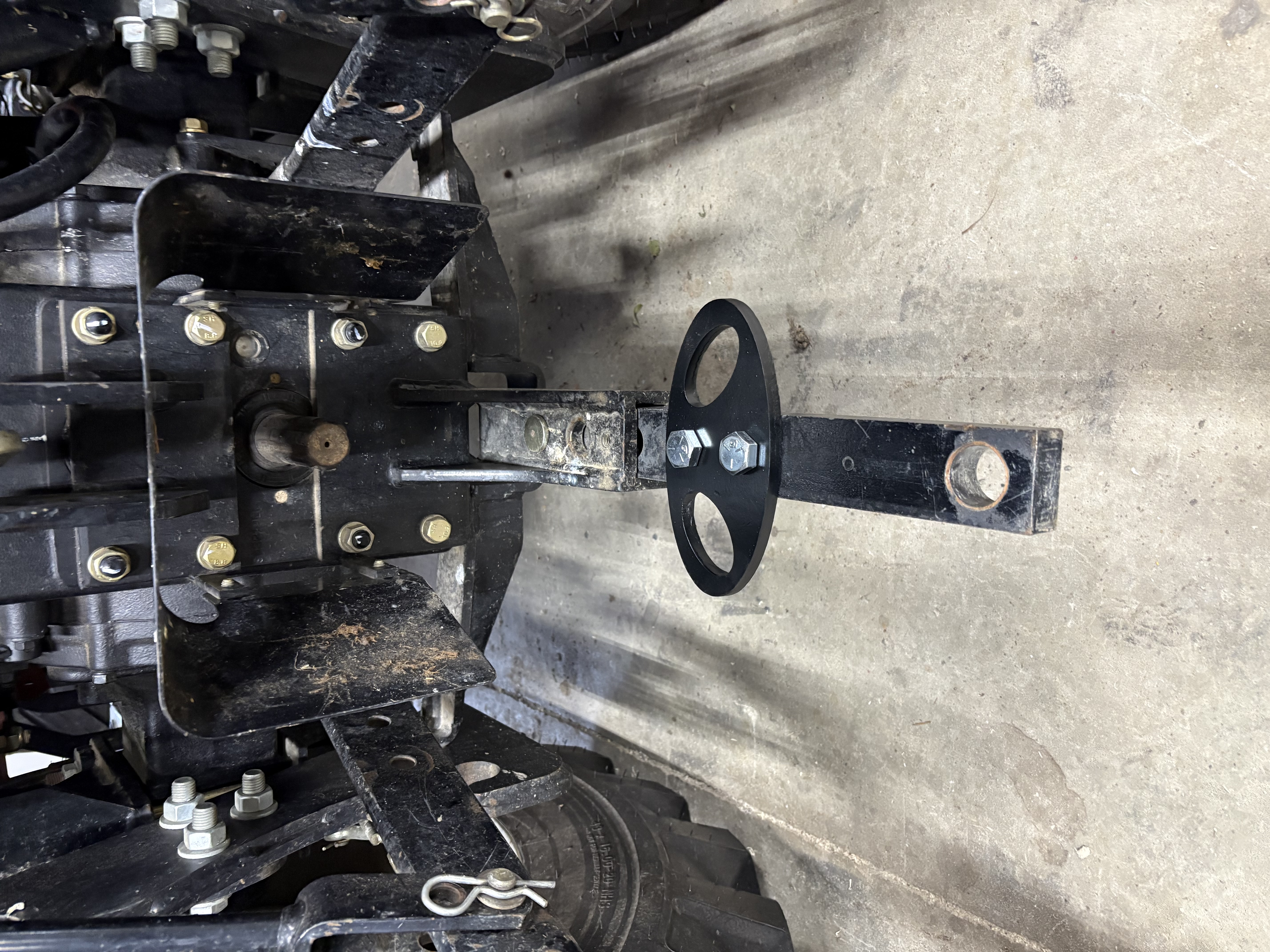 Bolt-on rear tie down point for drawbar