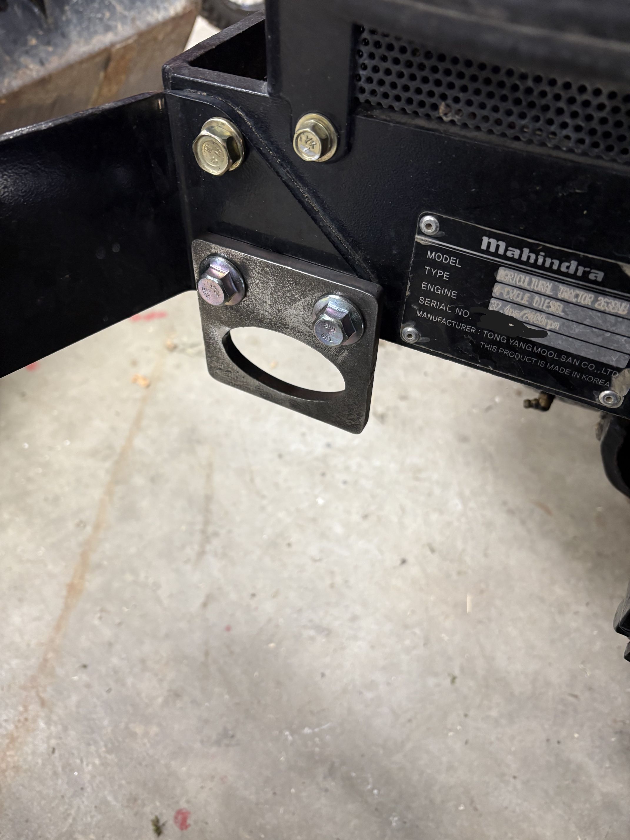 Bolt-on front tie down points