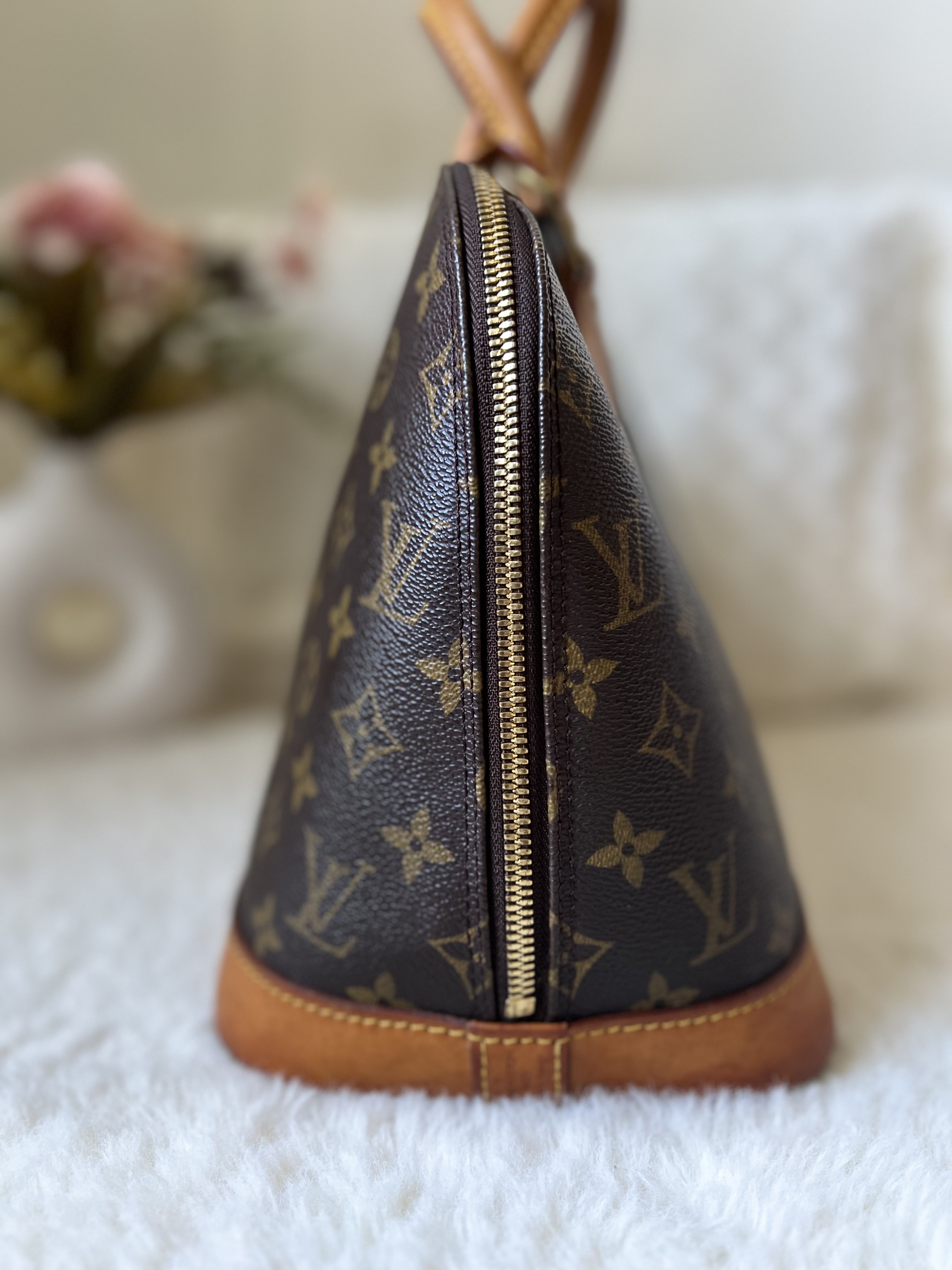 Louis Vuitton Alma Monogram Handbag