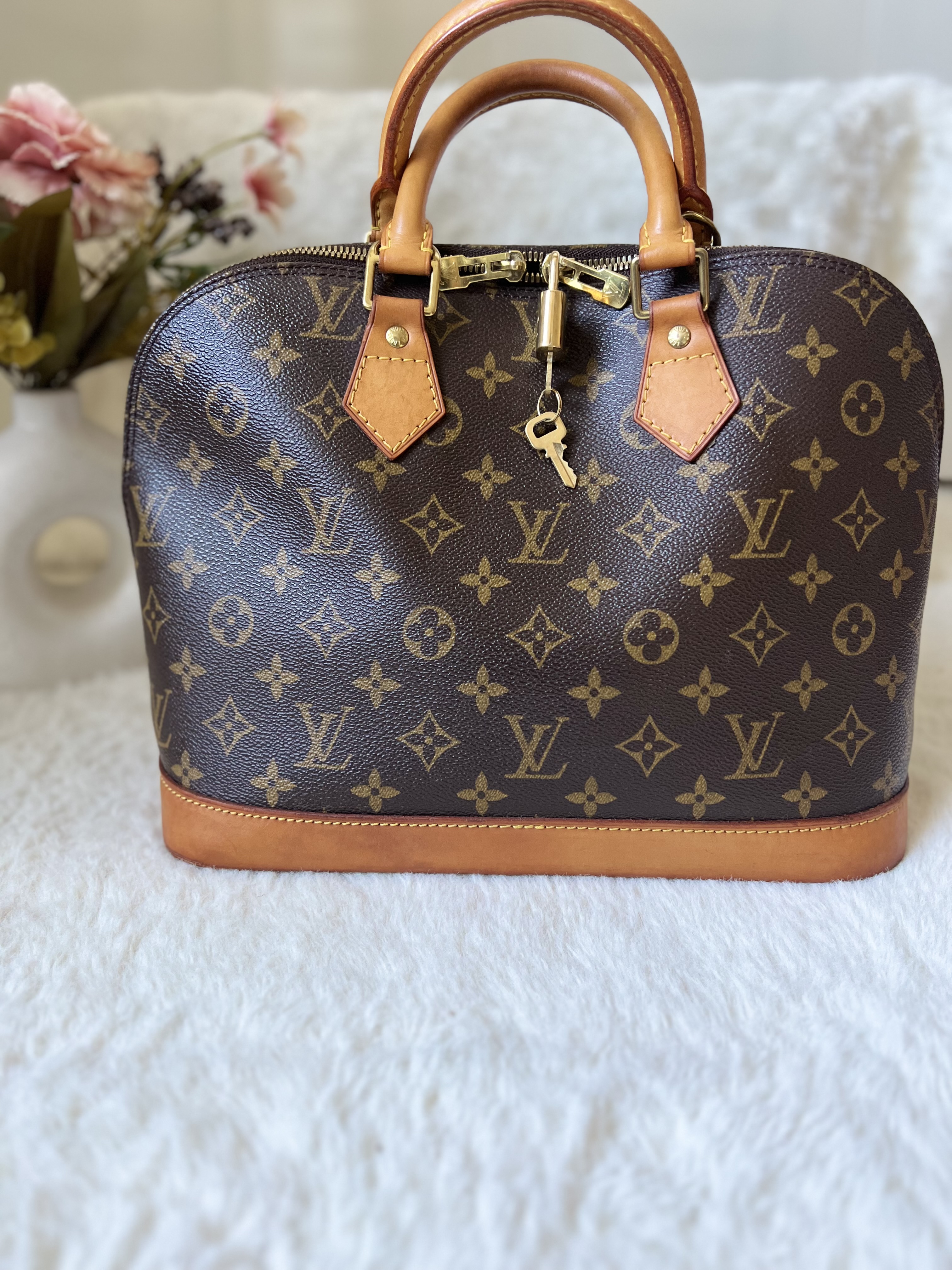 Louis Vuitton Alma Monogram Handbag