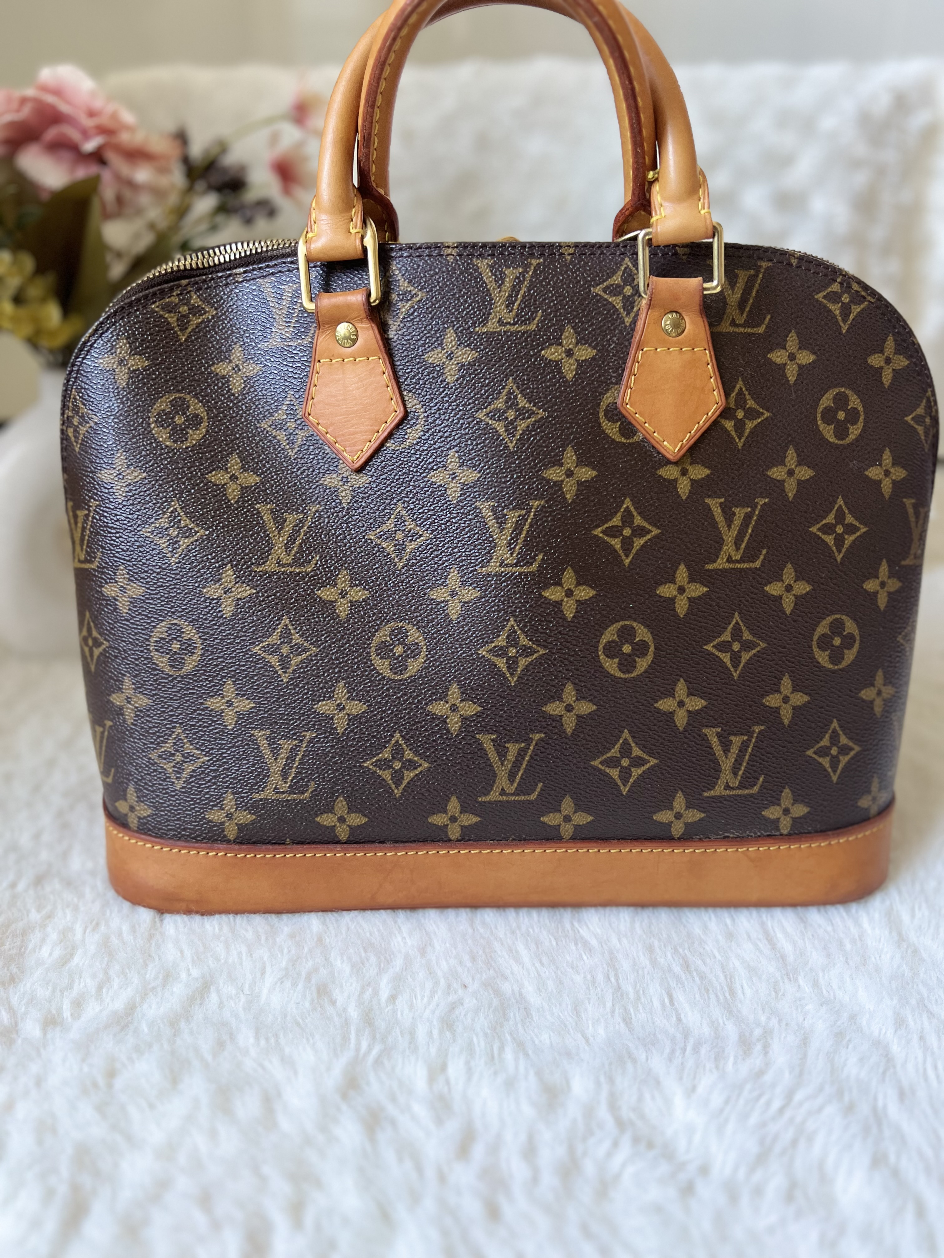 Louis Vuitton Alma Monogram Handbag
