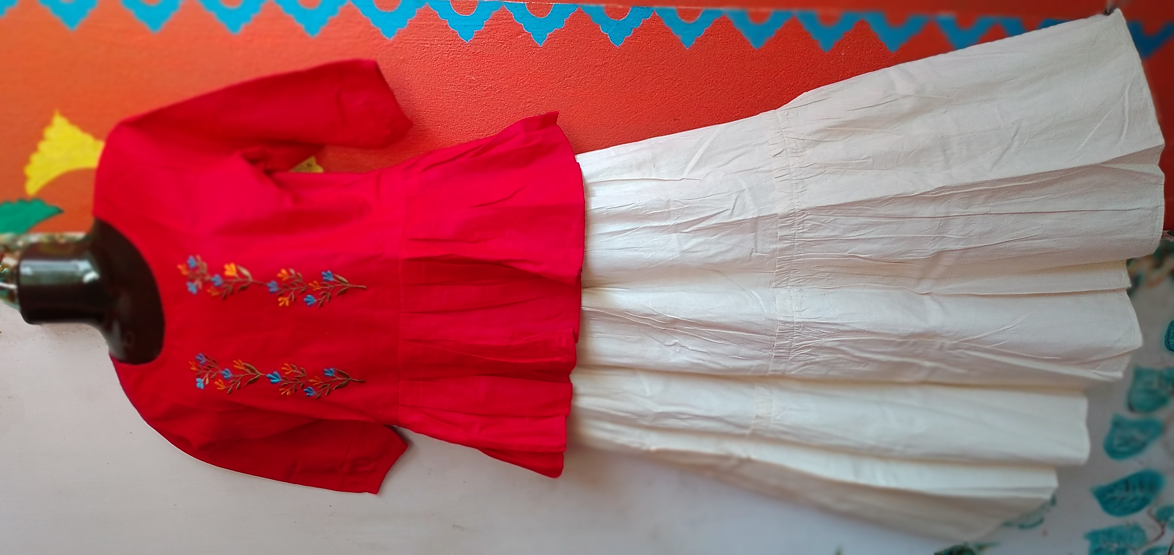 SUNNY BLISS - Peplum Hem Fitted pleated V Neck Sleeveless Top in Haze Red.