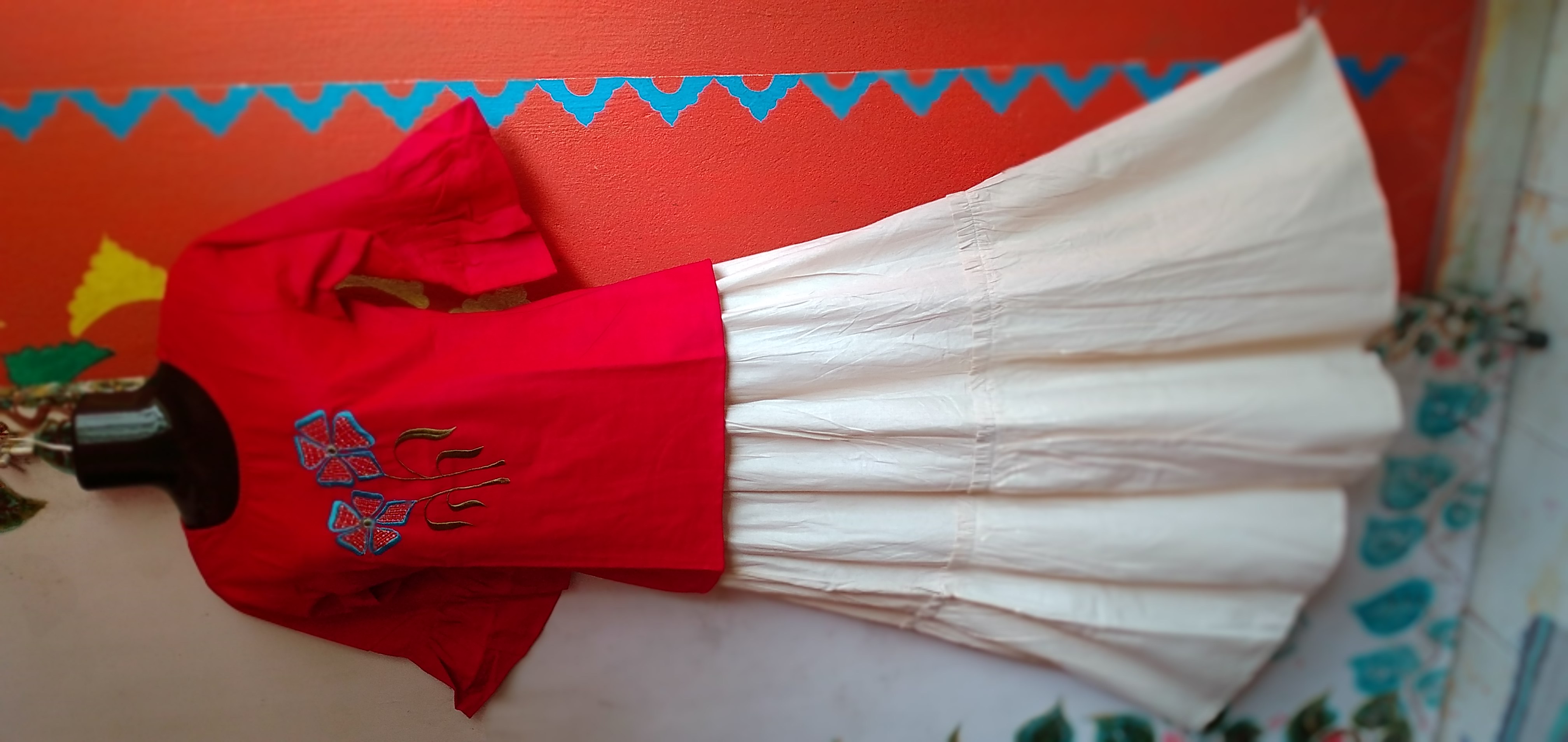 SUNNY BLISS - Peplum Hem Fitted pleated V Neck Sleeveless Top in Haze Red.