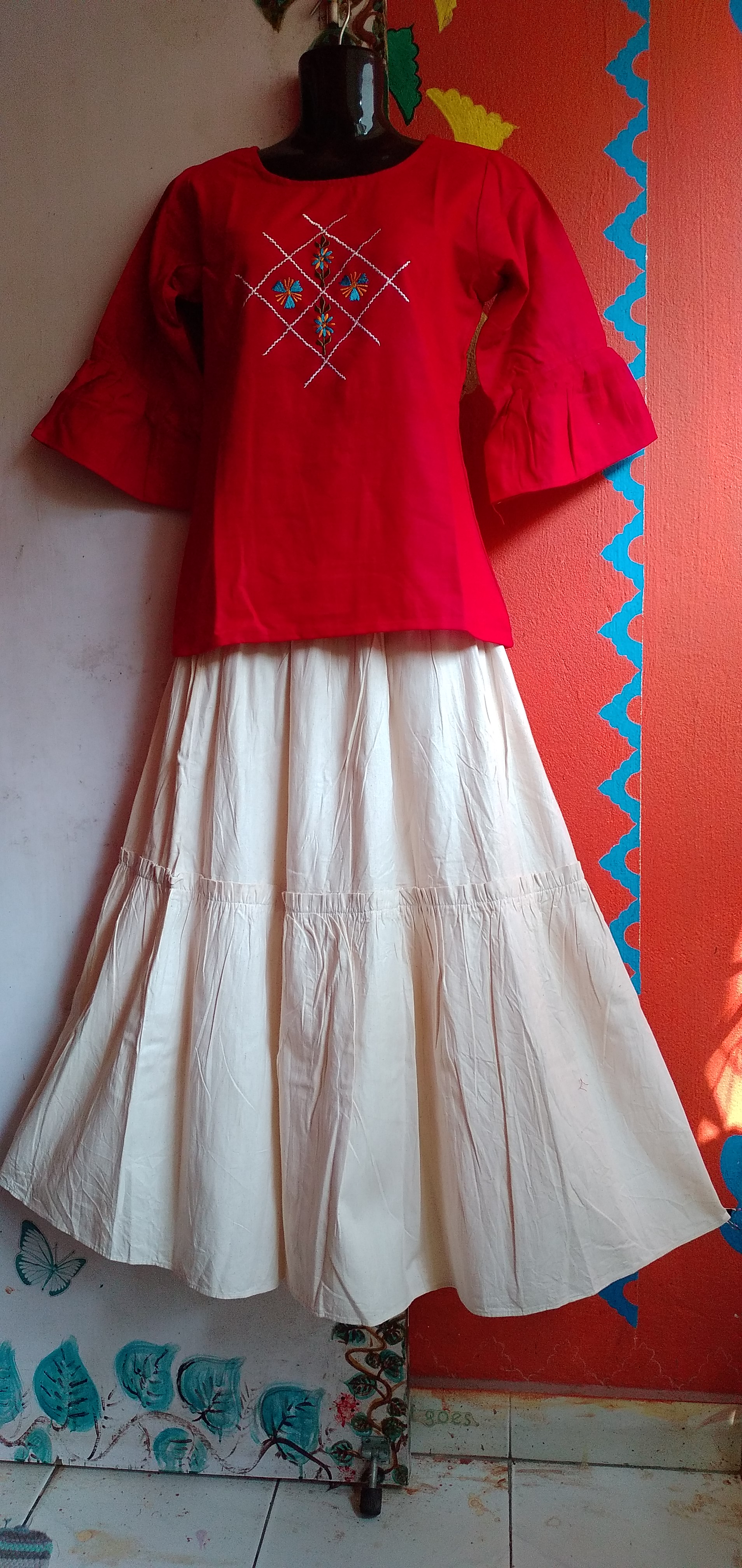 SUNNY BLISS - Peplum Hem Fitted pleated V Neck Sleeveless Top in Haze Red.