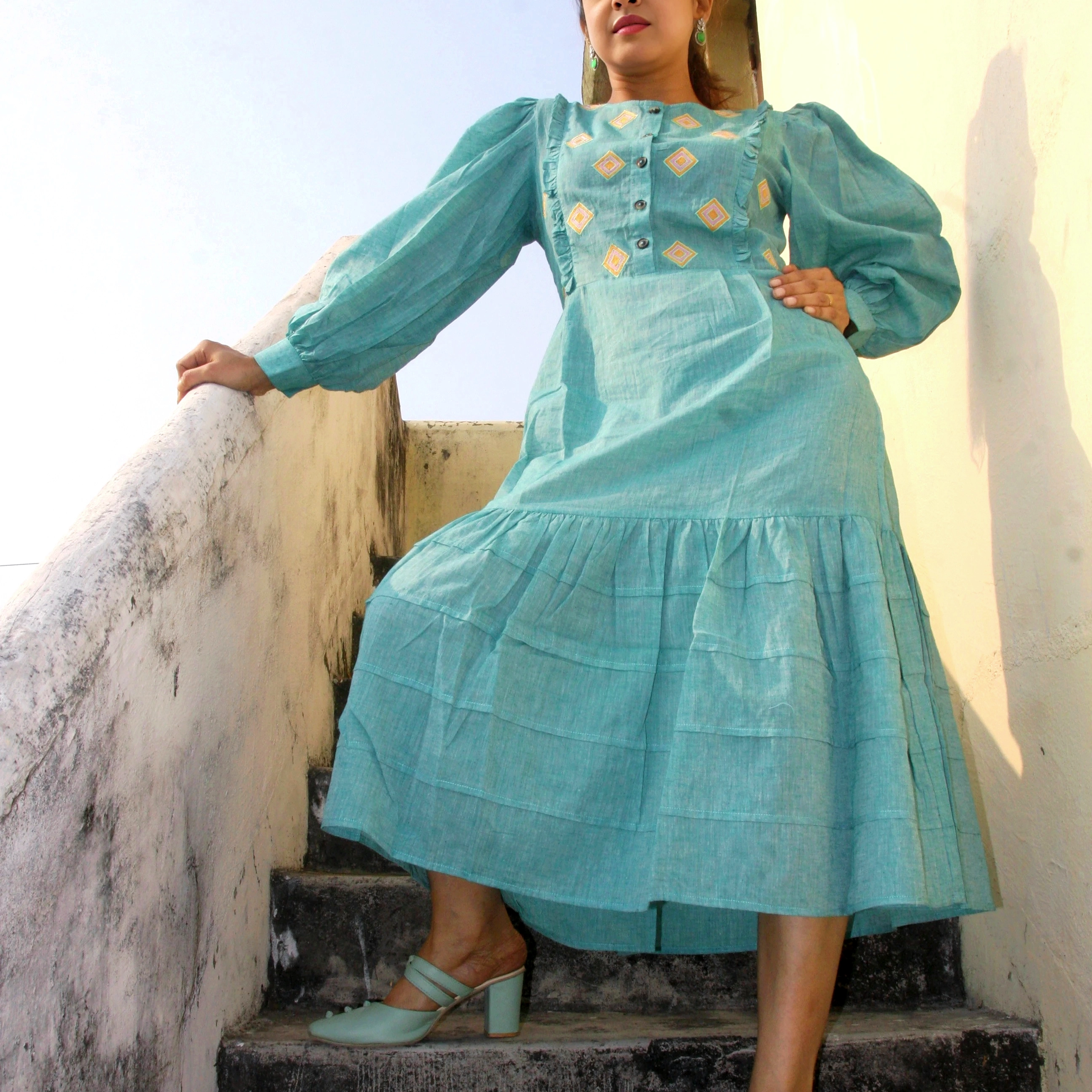 COASTLINE - Emerald Green Round Neck Embroidered Full Sleeved Tiered A-Line Dress.