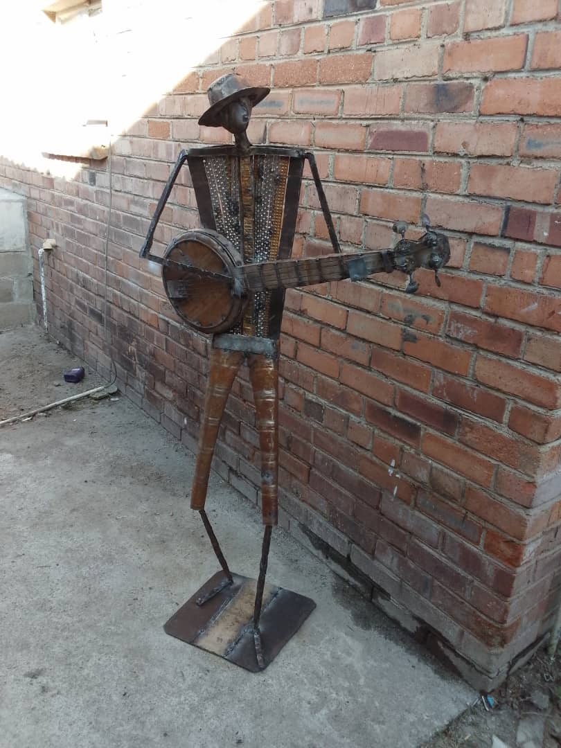 Car Part Banjo Player Sculpture