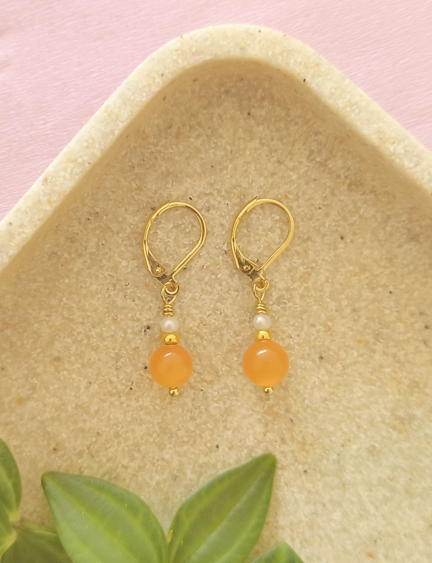 Oranje cateye oorbellen