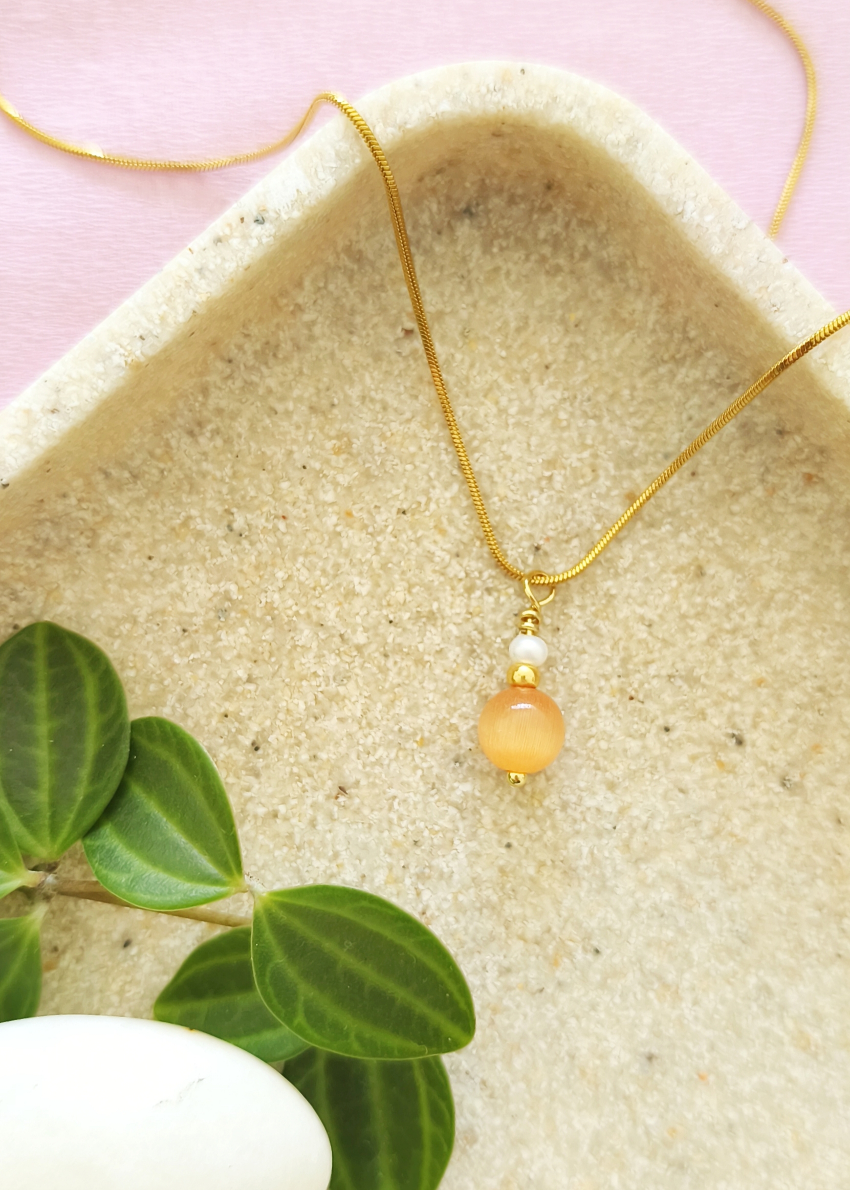 Oranje cateye ketting