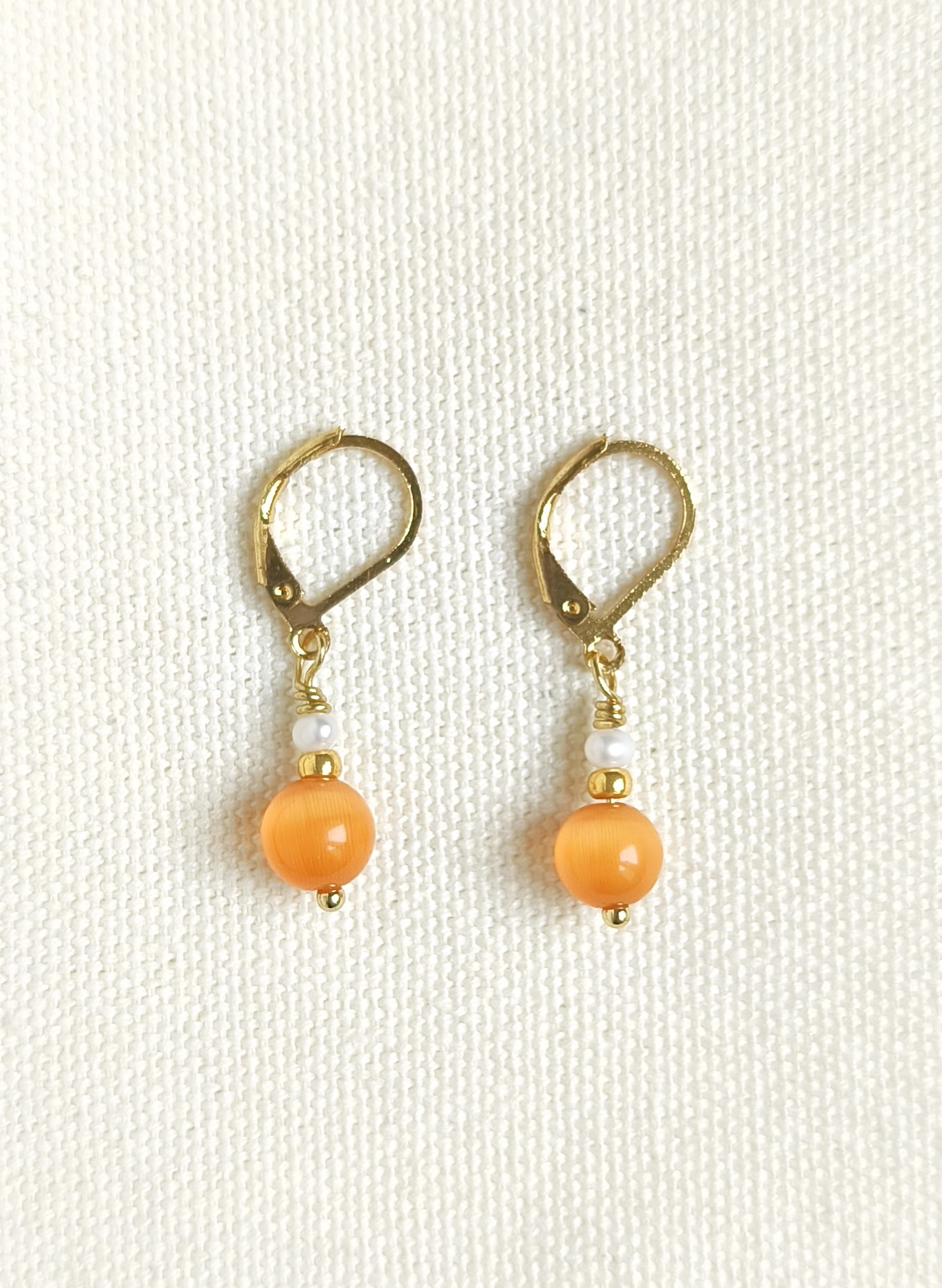 Oranje cateye oorbellen