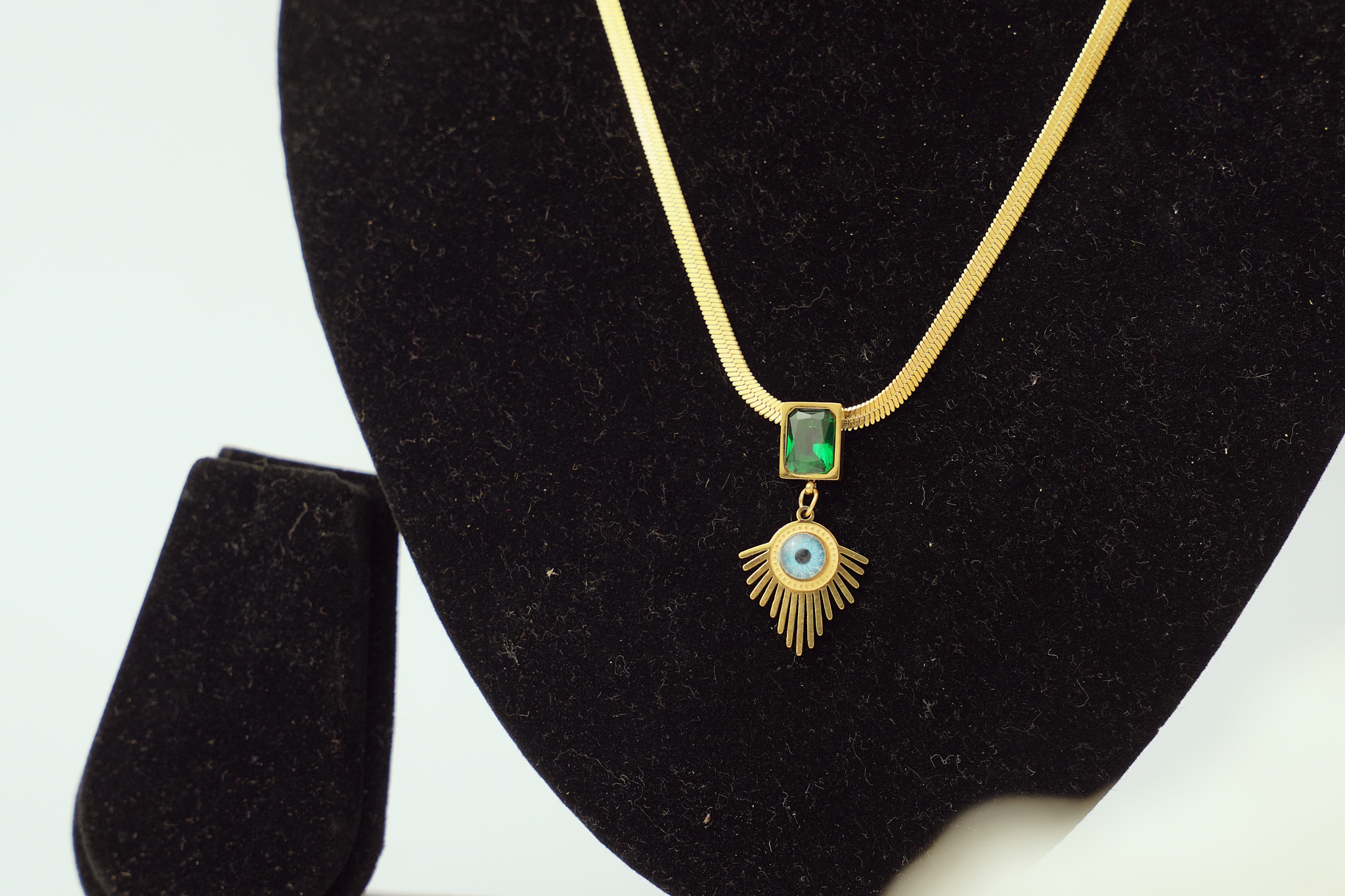 Gold necklace with evil eye pendant