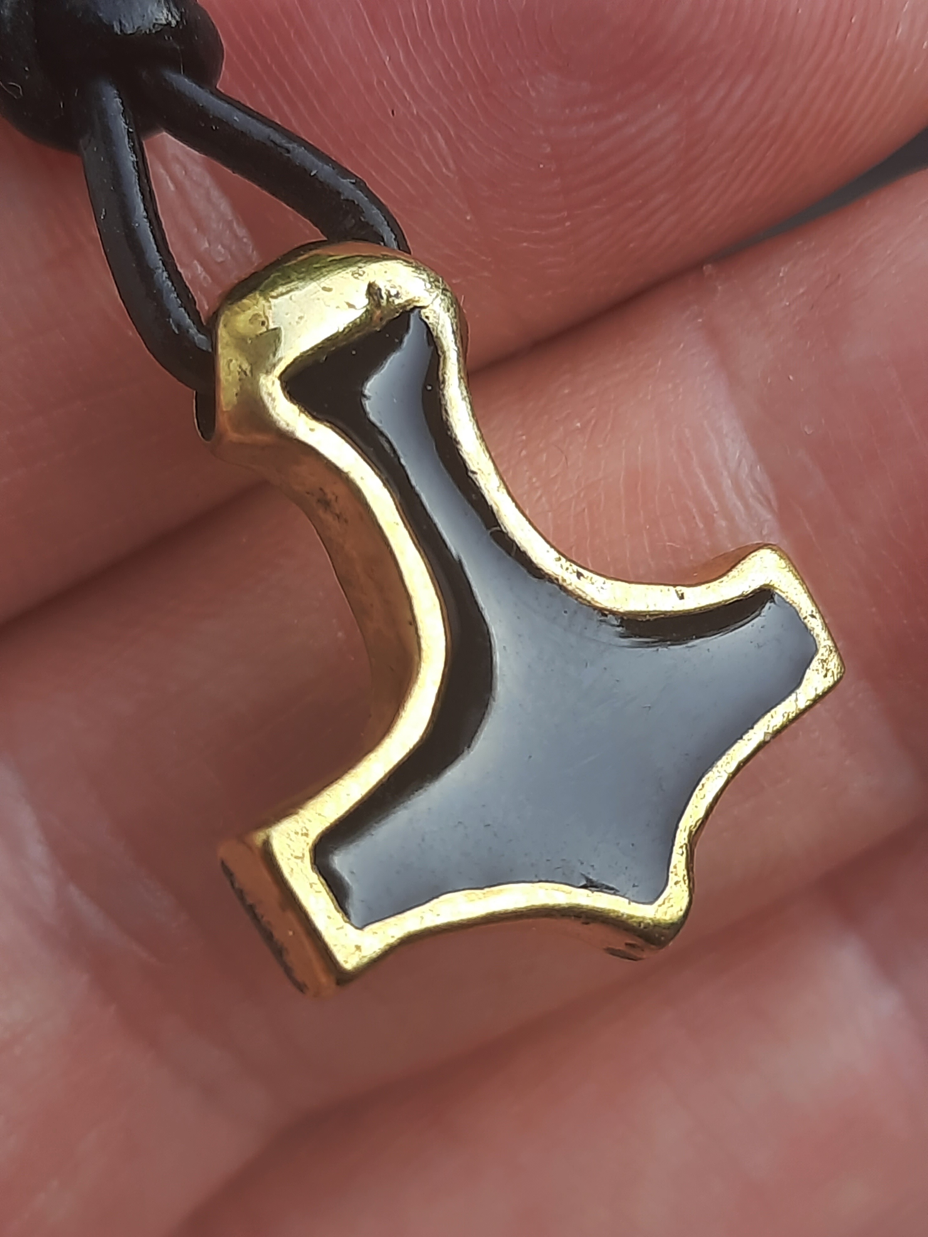 Forged from real battlefield brass and finished with black enamel – a timeless Viking symbol of strength, mystery, and divine protection.