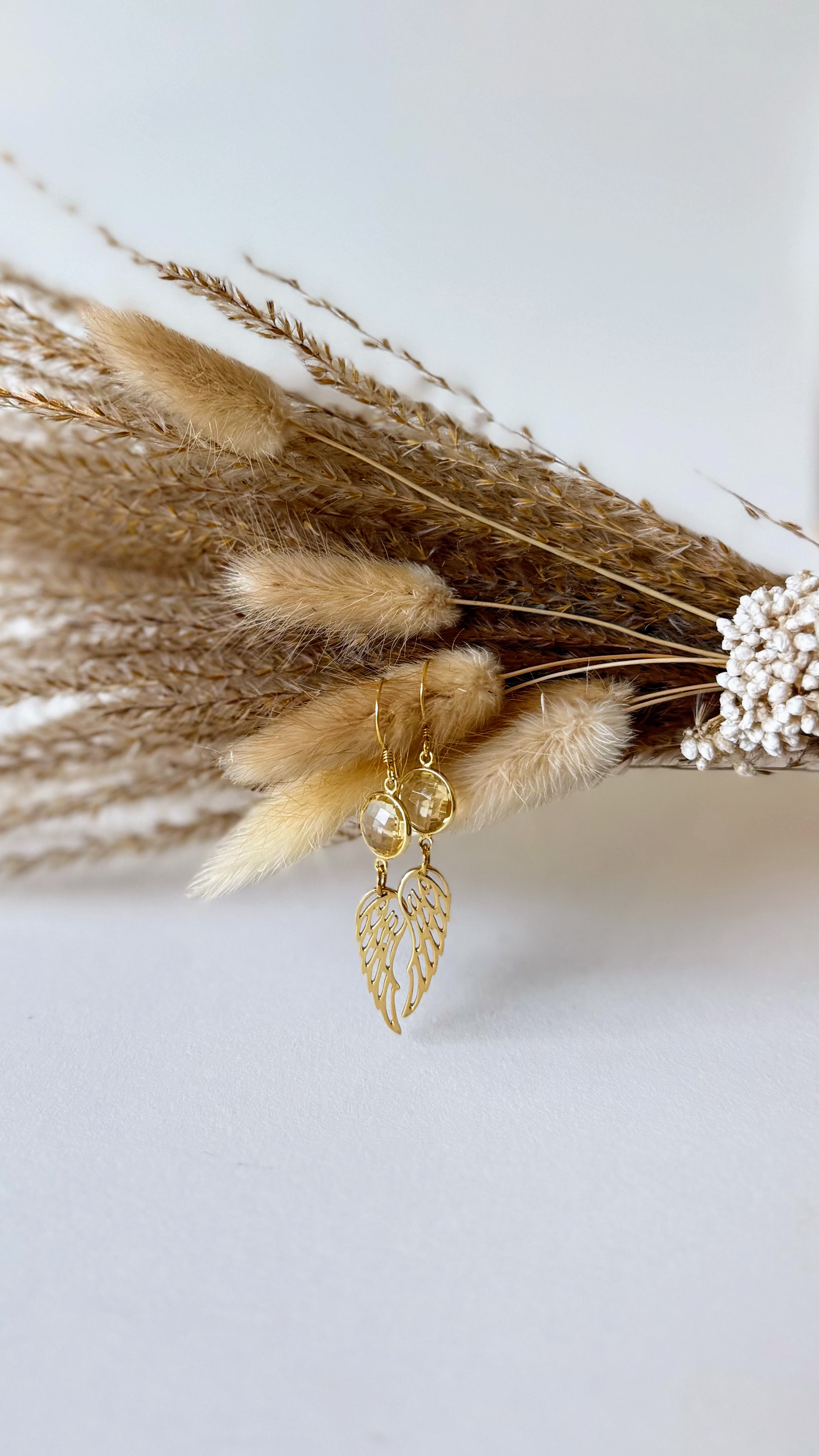 Citrine and gold feather element dangling earrings