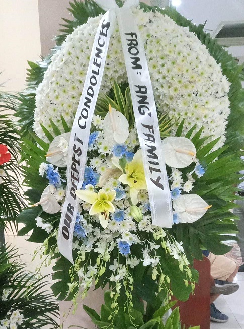 Radiance white & blue funeral Flower Arrangement