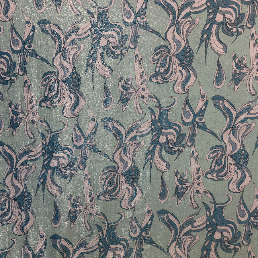 نقشة فراشات باللون الأزرق على خلفية خضراء فاتحة