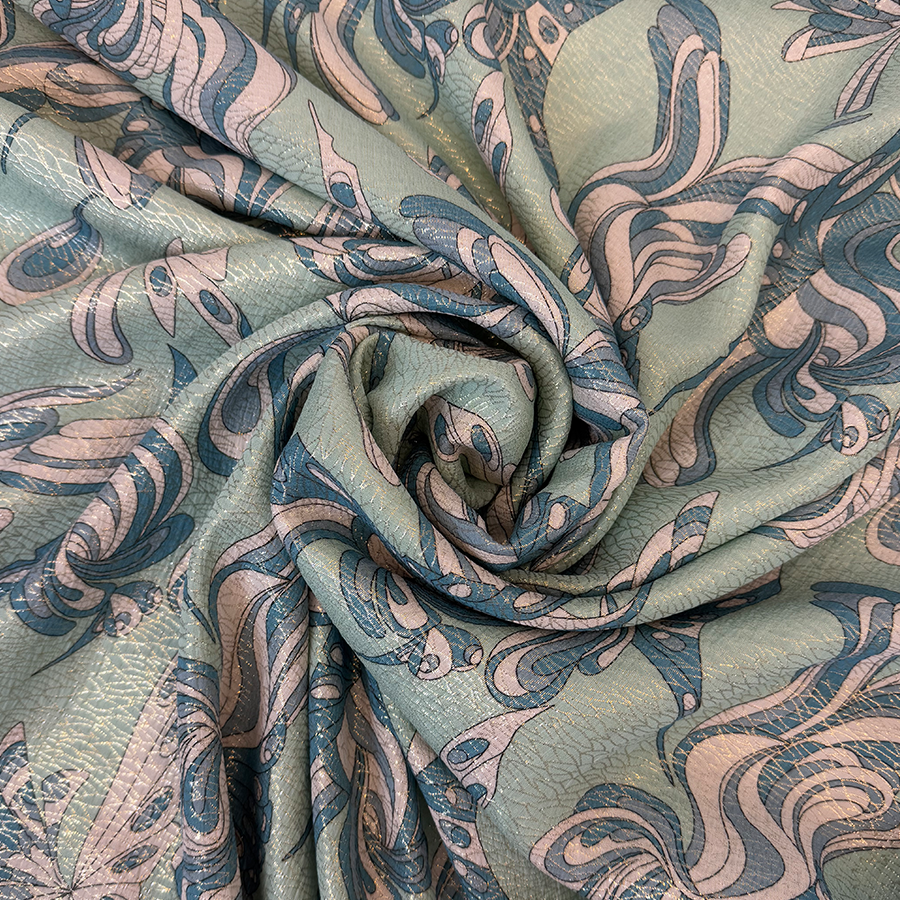 نقشة فراشات باللون الأزرق على خلفية خضراء فاتحة