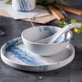 Ceramic bowl with blue splash design