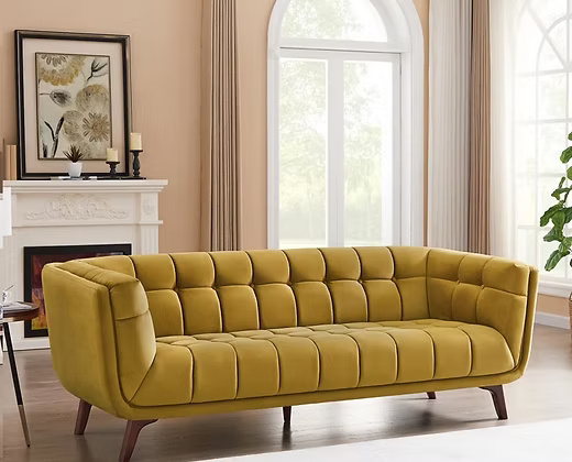 3 Seater Elegant velvet sofa with a tufted back and seat.