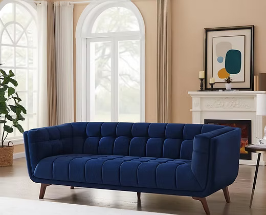 3 Seater Elegant velvet sofa with a tufted back and seat.