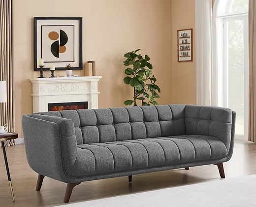 3 Seater Elegant velvet sofa with a tufted back and seat.