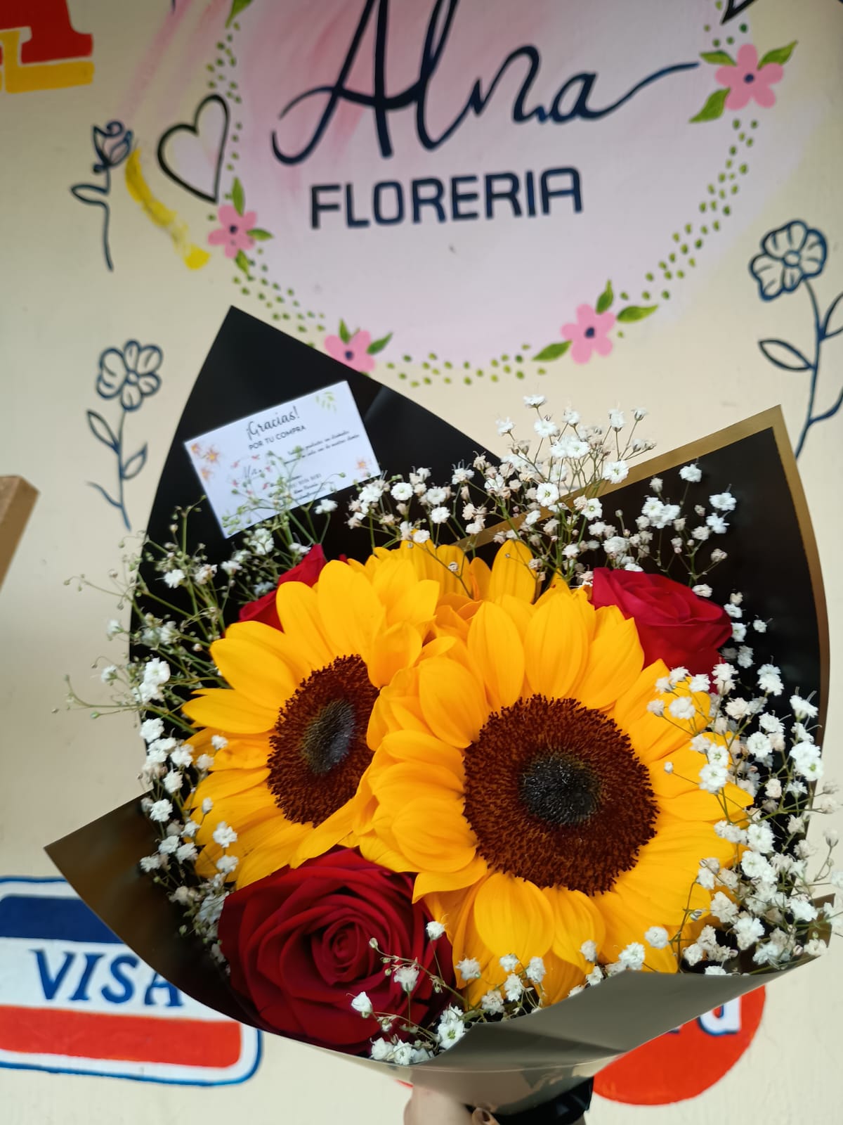 Ramo de girasoles y rosas