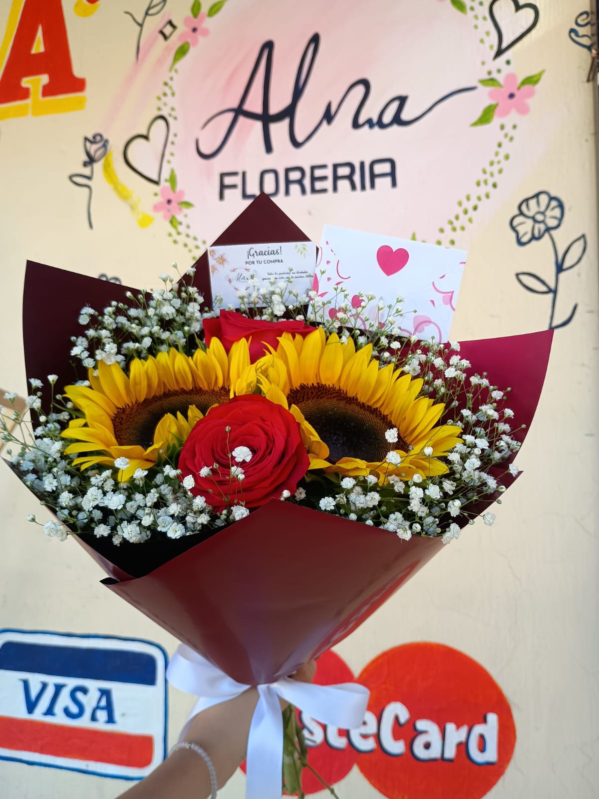 Ramo de girasoles y rosas